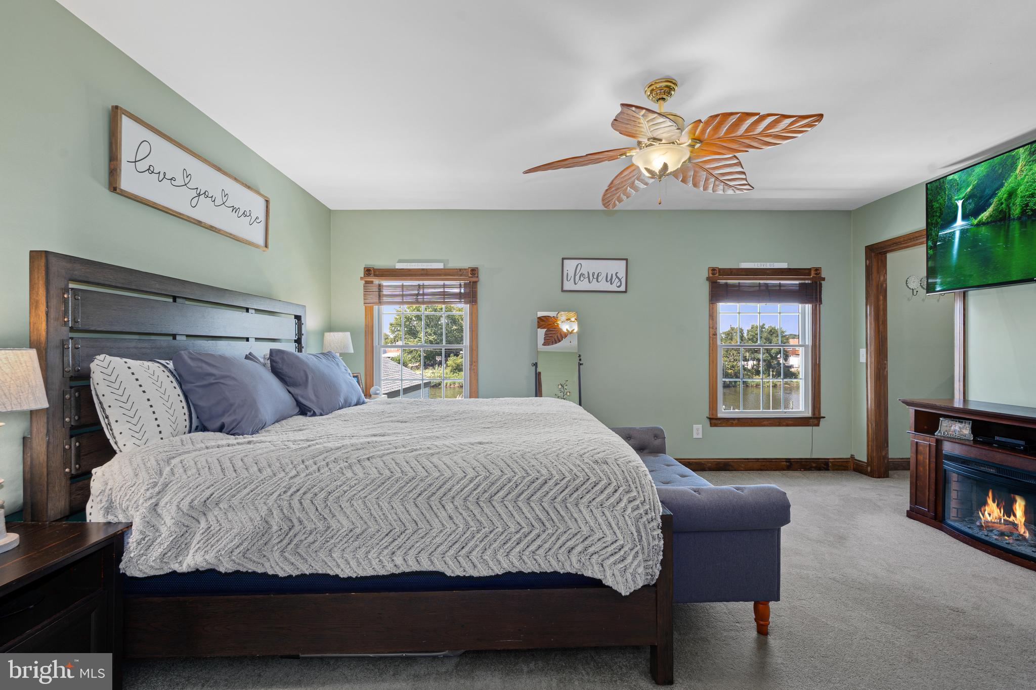 7808 Deboy Avenue Baltimore, MD 21222 - Photo 19 of 36 a bedroom with a bed and a chandelier