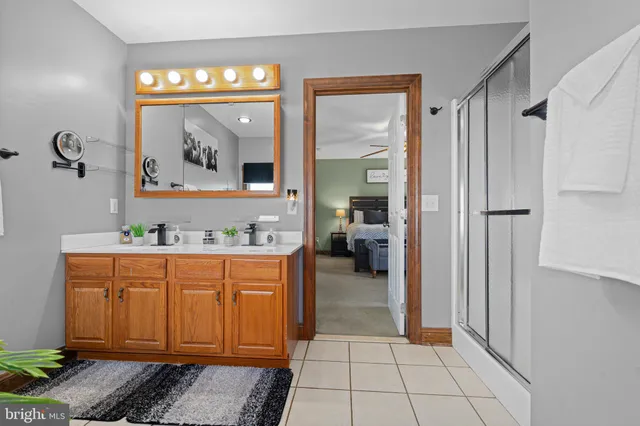 a spacious bathroom with a tub and shower