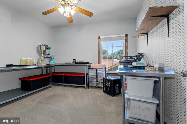 a bedroom with bed and a chandelier