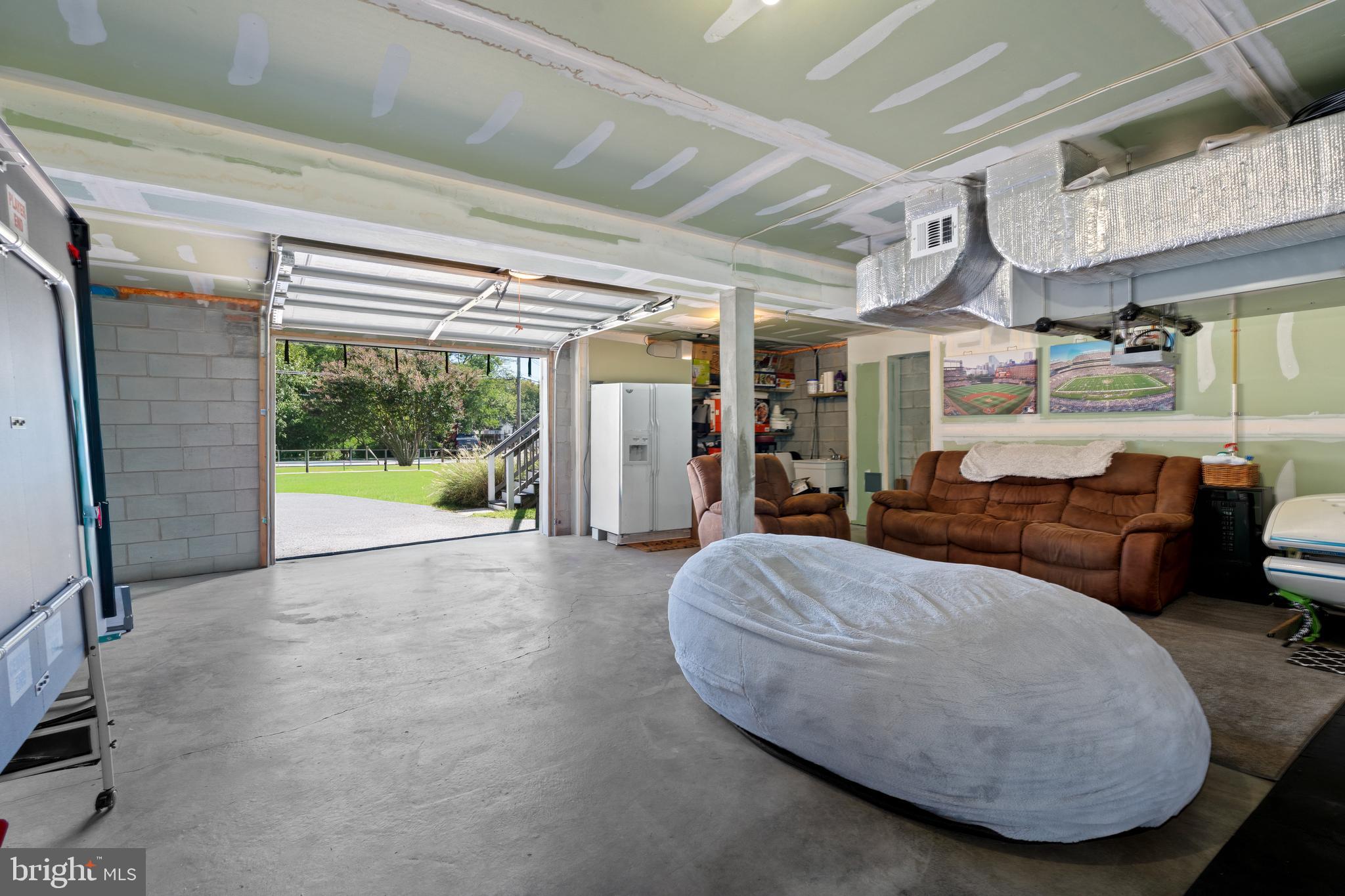 7808 Deboy Avenue Baltimore, MD 21222 - Photo 30 of 36 a living room with furniture and a large window