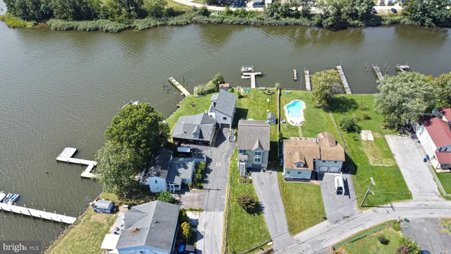an aerial view of a house with a lake view