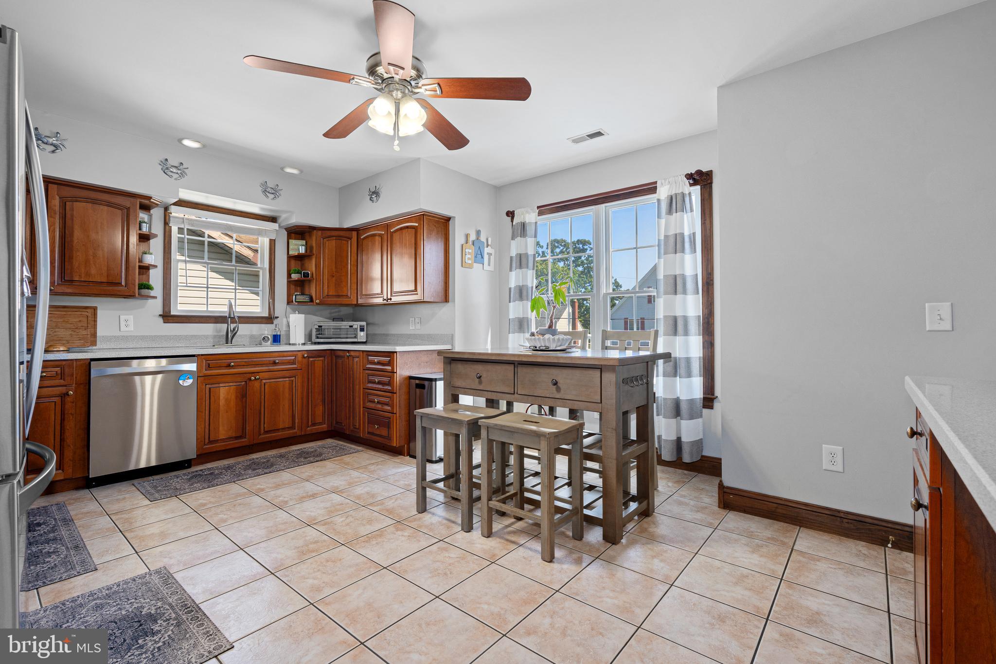 7808 Deboy Avenue Baltimore, MD 21222 - Photo 5 of 36 a kitchen with stainless steel appliances a sink counter space and a window