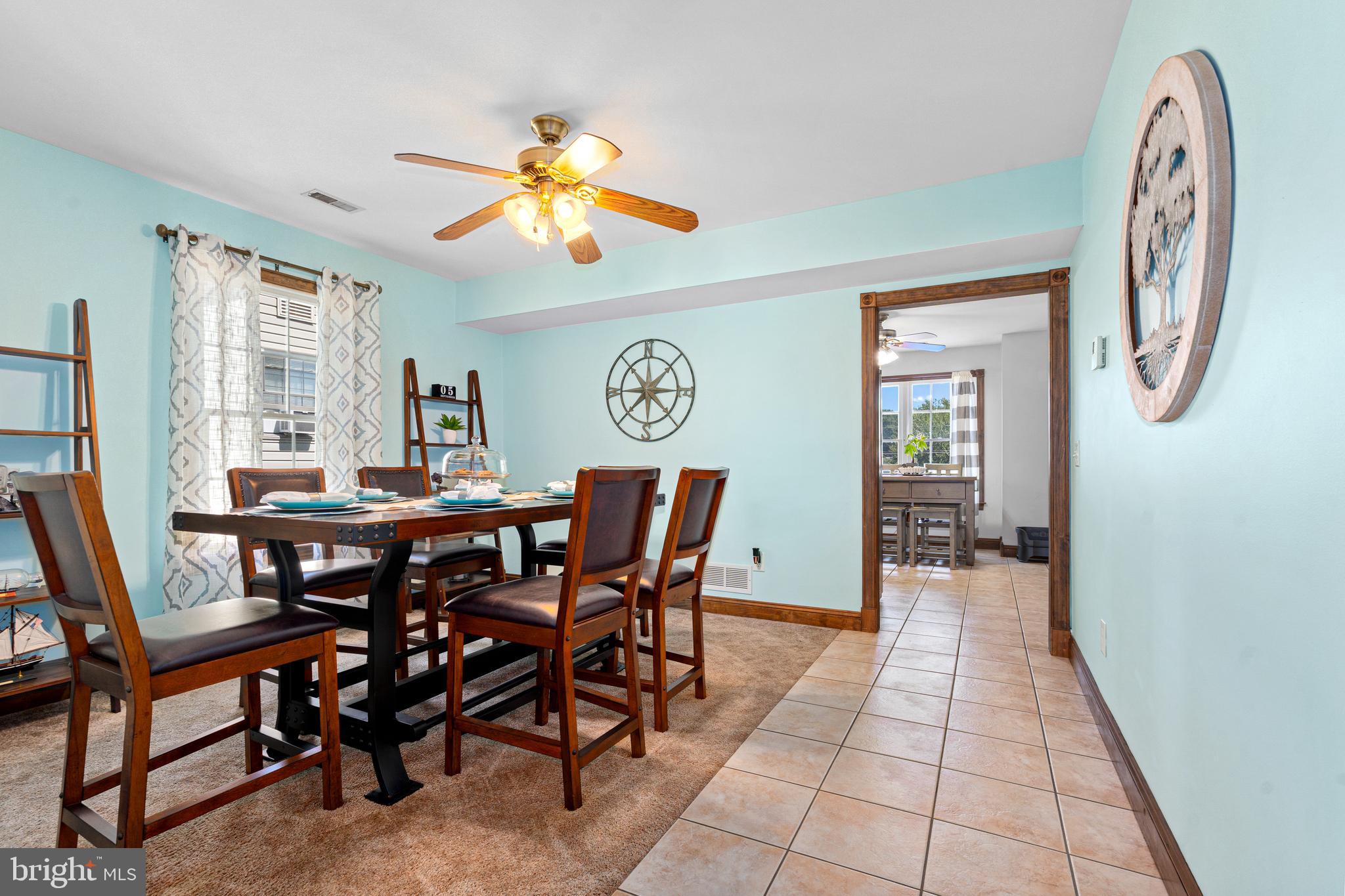 7808 Deboy Avenue Baltimore, MD 21222 - Photo 9 of 36 a view of a dining room with furniture and chandelier