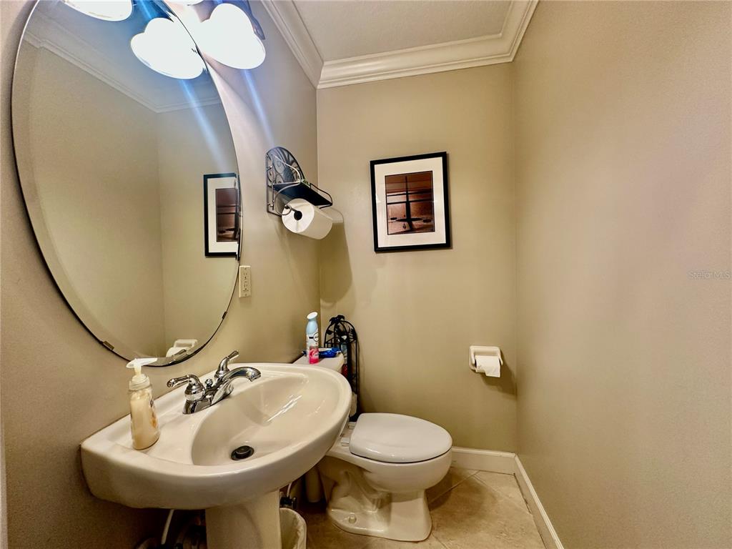 135 Shoals Circle North Redington Beach, FL 33708 - Photo 14 of 80 a bathroom with a sink mirror and toilet