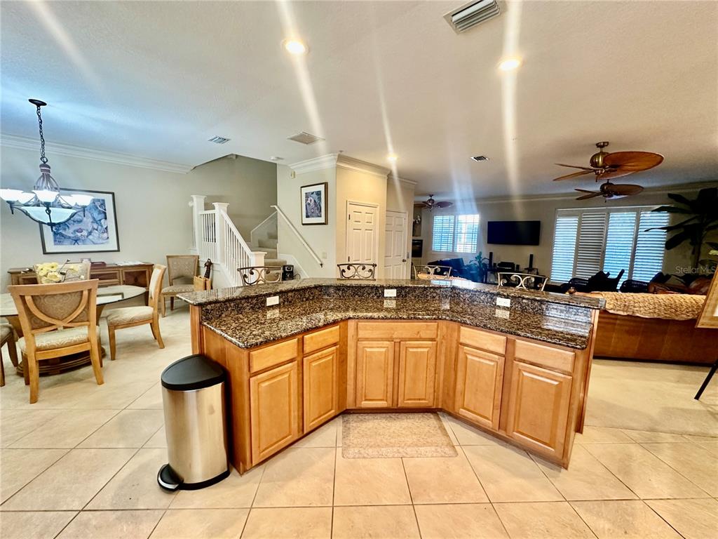 135 Shoals Circle North Redington Beach, FL 33708 - Photo 20 of 80 a kitchen with a sink stove and cabinets