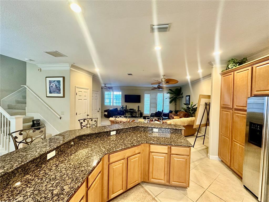 135 Shoals Circle North Redington Beach, FL 33708 - Photo 23 of 80 a kitchen with stainless steel appliances granite countertop a sink and a refrigerator