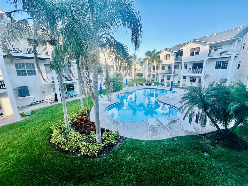 135 Shoals Circle North Redington Beach, FL 33708 - Photo 32 of 80 a view of a house with a swimming pool