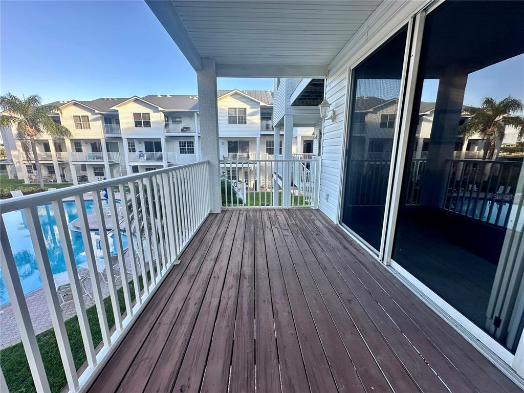 135 Shoals Circle North Redington Beach, FL 33708 - Photo 36 of 80 a view of a balcony with wooden floor