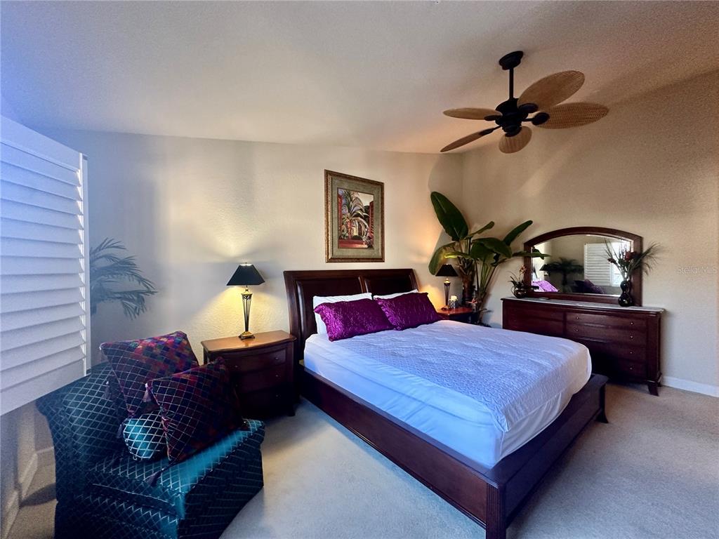 135 Shoals Circle North Redington Beach, FL 33708 - Photo 41 of 80 a bedroom with a bed and wooden floor