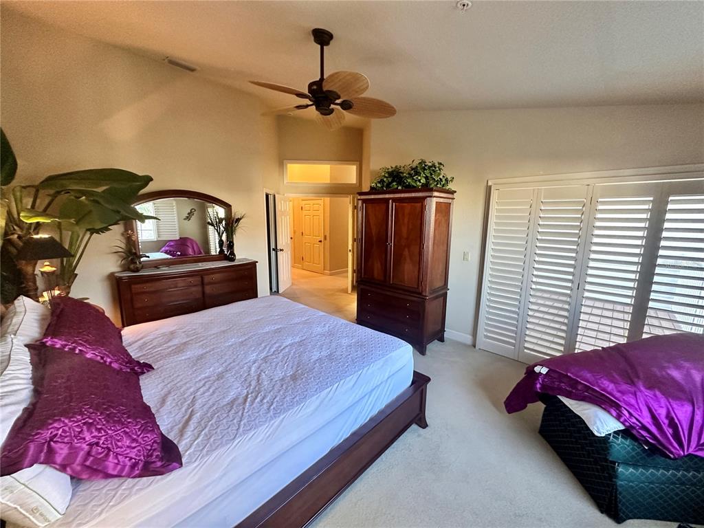 135 Shoals Circle North Redington Beach, FL 33708 - Photo 42 of 80 a bedroom with a bed dresser and a window