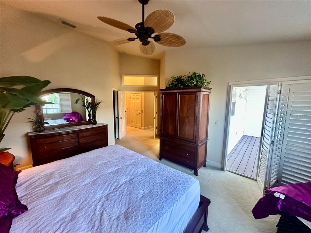 135 Shoals Circle North Redington Beach, FL 33708 - Photo 45 of 80 a bedroom with a bed and a dresser