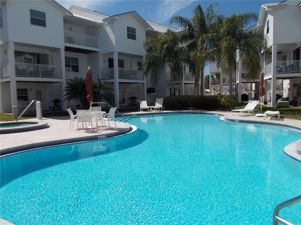 135 Shoals Circle North Redington Beach, FL 33708 - Photo 5 of 80 a view of a house with swimming pool and sitting area