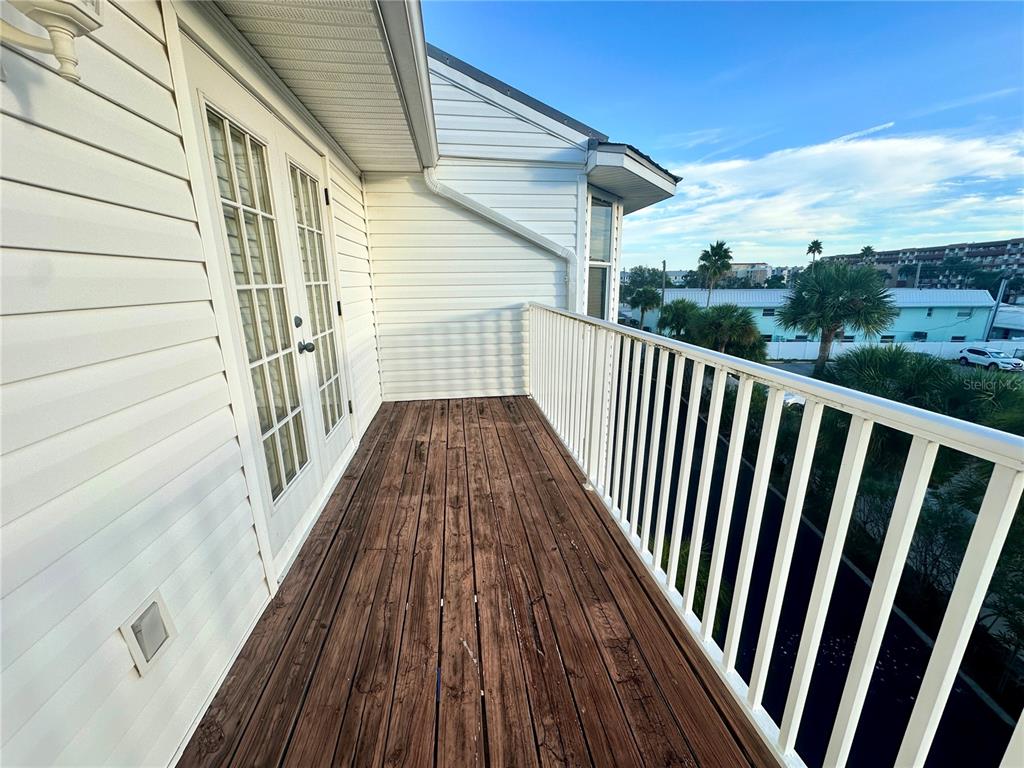 135 Shoals Circle North Redington Beach, FL 33708 - Photo 52 of 80 a view of balcony with wooden floor