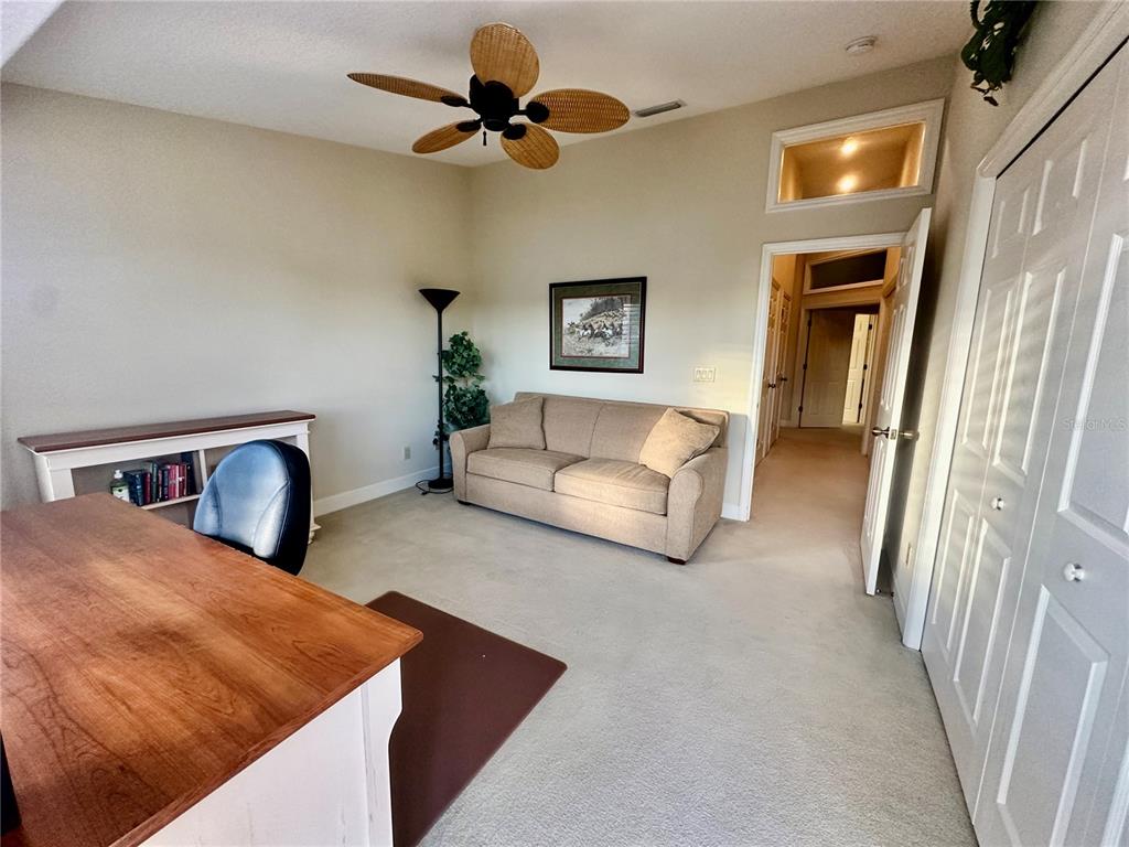 135 Shoals Circle North Redington Beach, FL 33708 - Photo 56 of 80 a bedroom with furniture and a chandelier