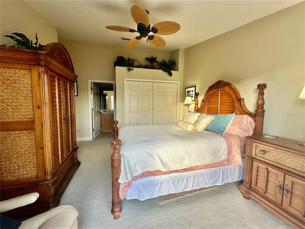 135 Shoals Circle North Redington Beach, FL 33708 - Photo 58 of 80 a bedroom with a bed dresser and a window