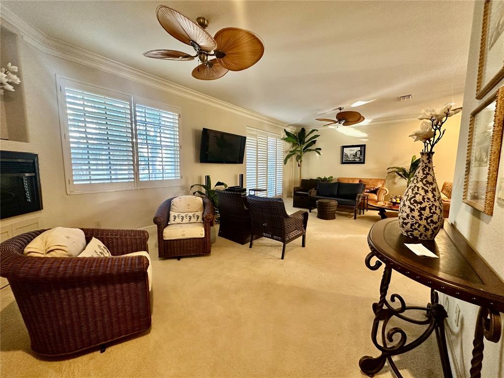 135 Shoals Circle North Redington Beach, FL 33708 - Photo 6 of 80 a living room with furniture and a flat screen tv