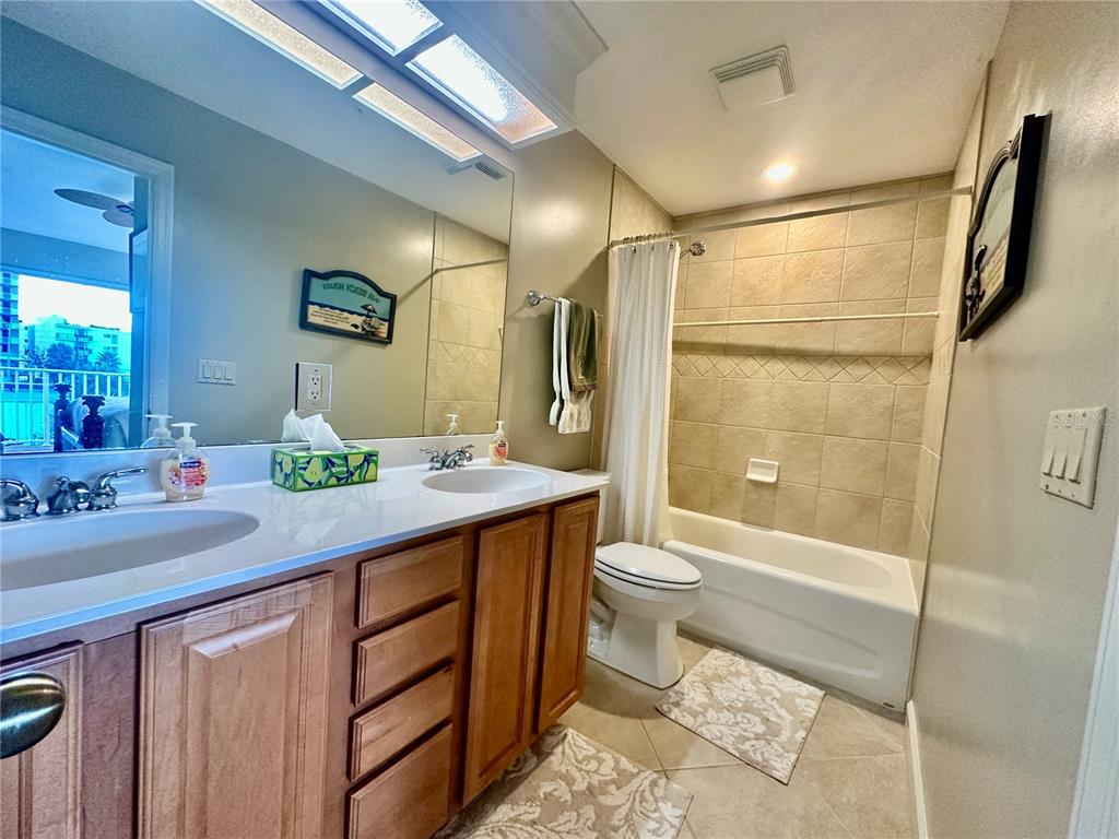 135 Shoals Circle North Redington Beach, FL 33708 - Photo 61 of 80 a bathroom with a granite countertop sink toilet and shower