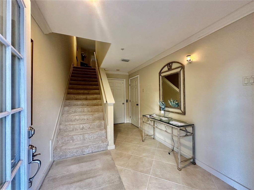 135 Shoals Circle North Redington Beach, FL 33708 - Photo 73 of 80 a view of a livingroom with wooden floor and stairs