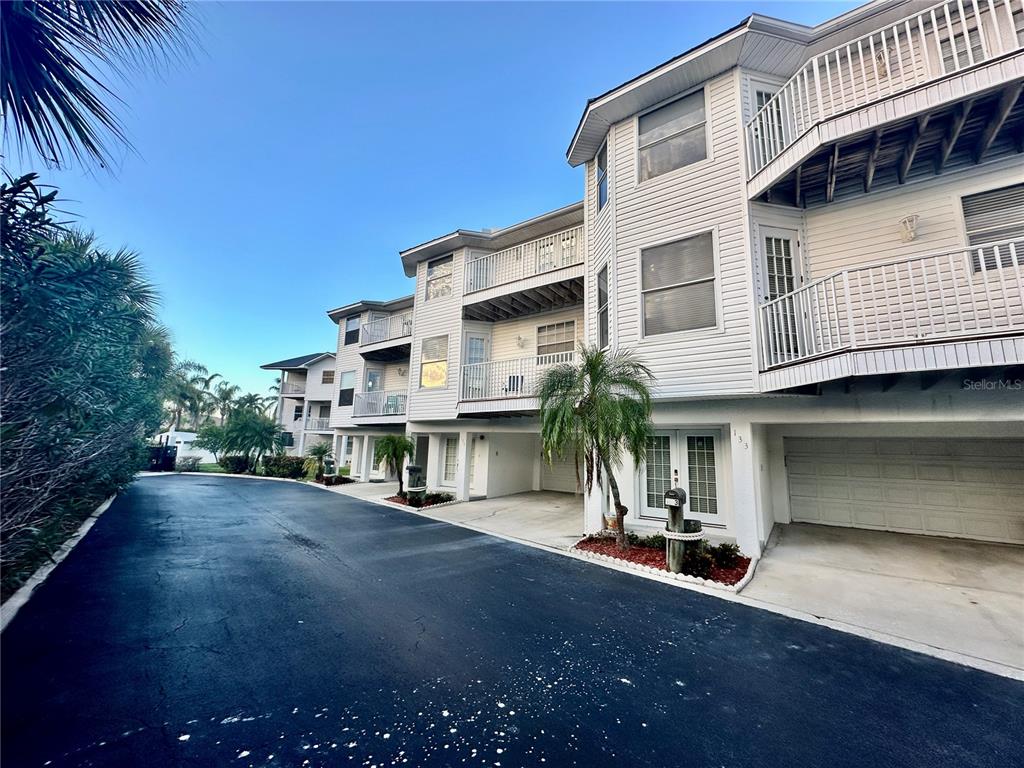 135 Shoals Circle North Redington Beach, FL 33708 - Photo 77 of 80 a view of a street with a building in the background