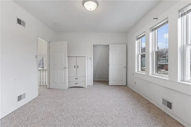 a view of empty room with windows