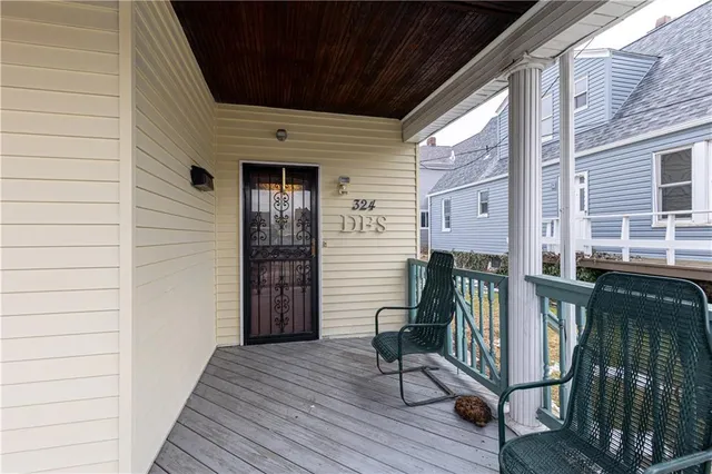 a view of balcony with wooden floor and stairs