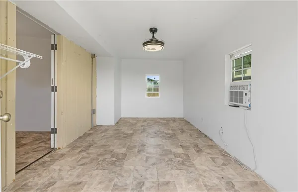 a view of an empty room and window