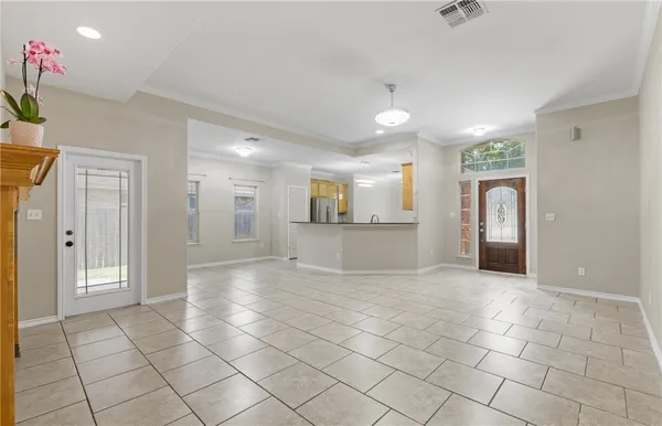 a view of a hallway with closet and a potted plant