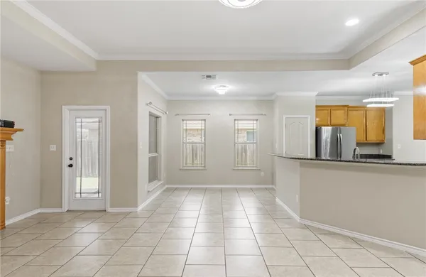 a view of a kitchen with a sink and a window