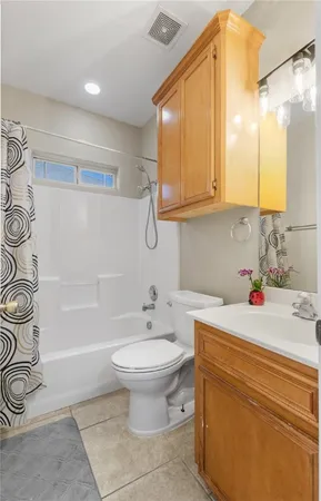 a bathroom with a sink a toilet and bathtub