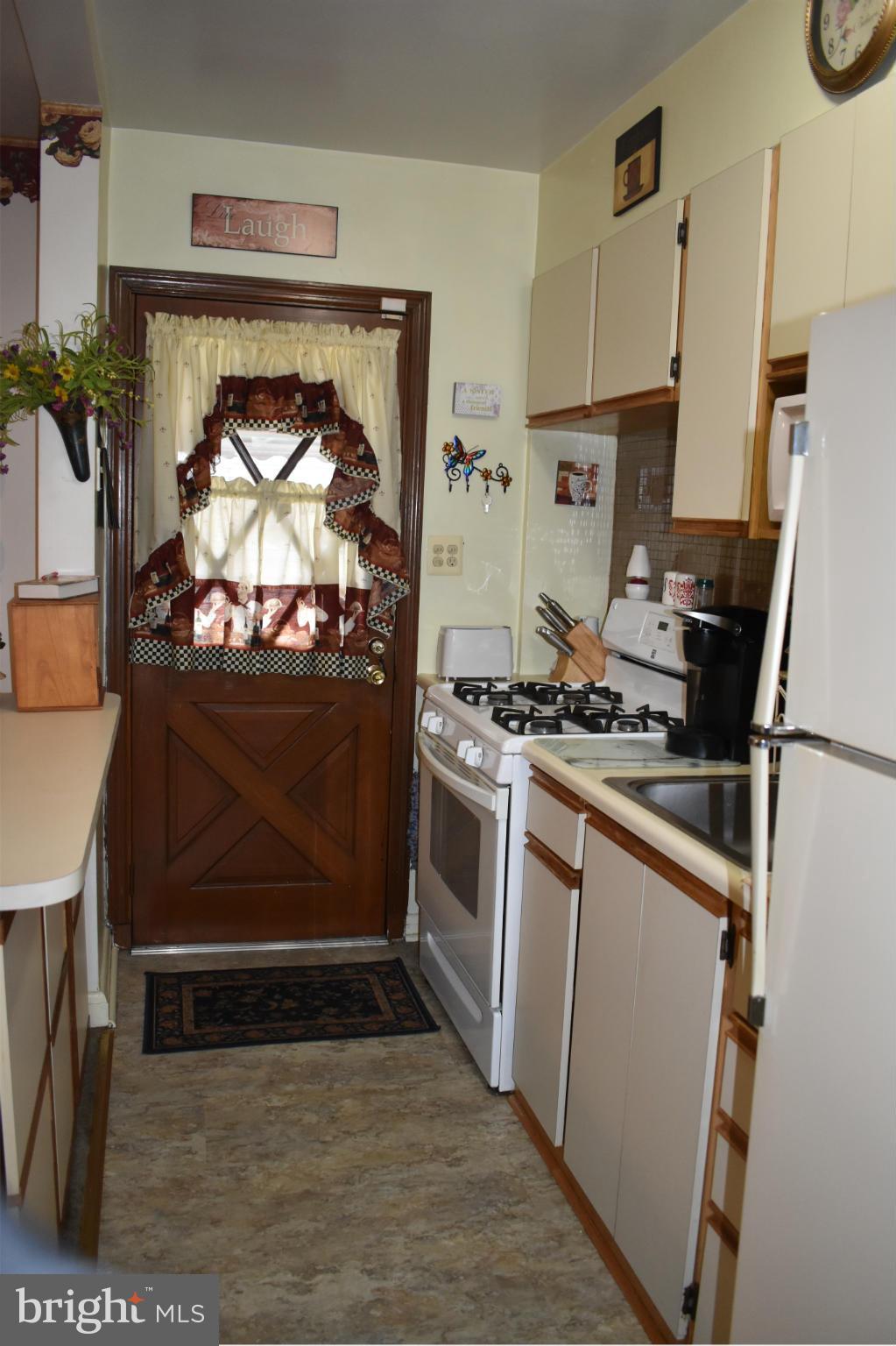 1617 Manor Road Baltimore, MD 21222 - Photo 12 of 28 Galley Kitchen leads to back covered patio
