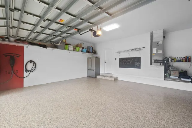 a living room with furniture a window and wooden floor