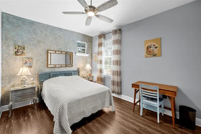 a hall way with furniture and wooden floor