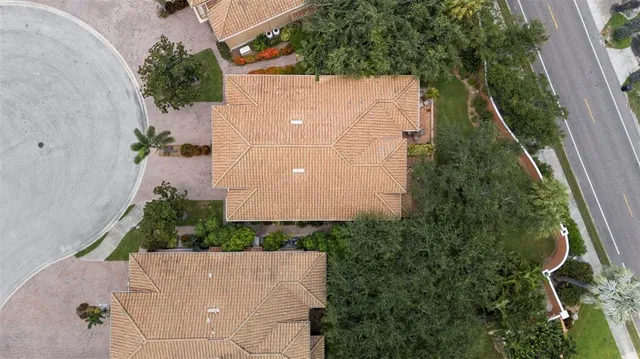 an aerial view of a house with a lake view