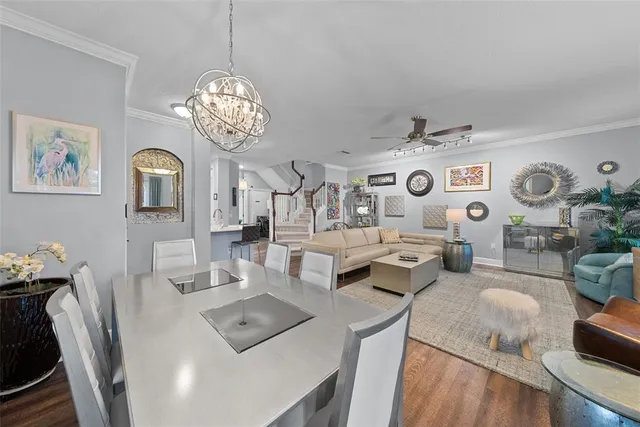 a living room with furniture and view of kitchen