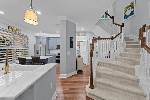 a view of living room with furniture and a chandelier