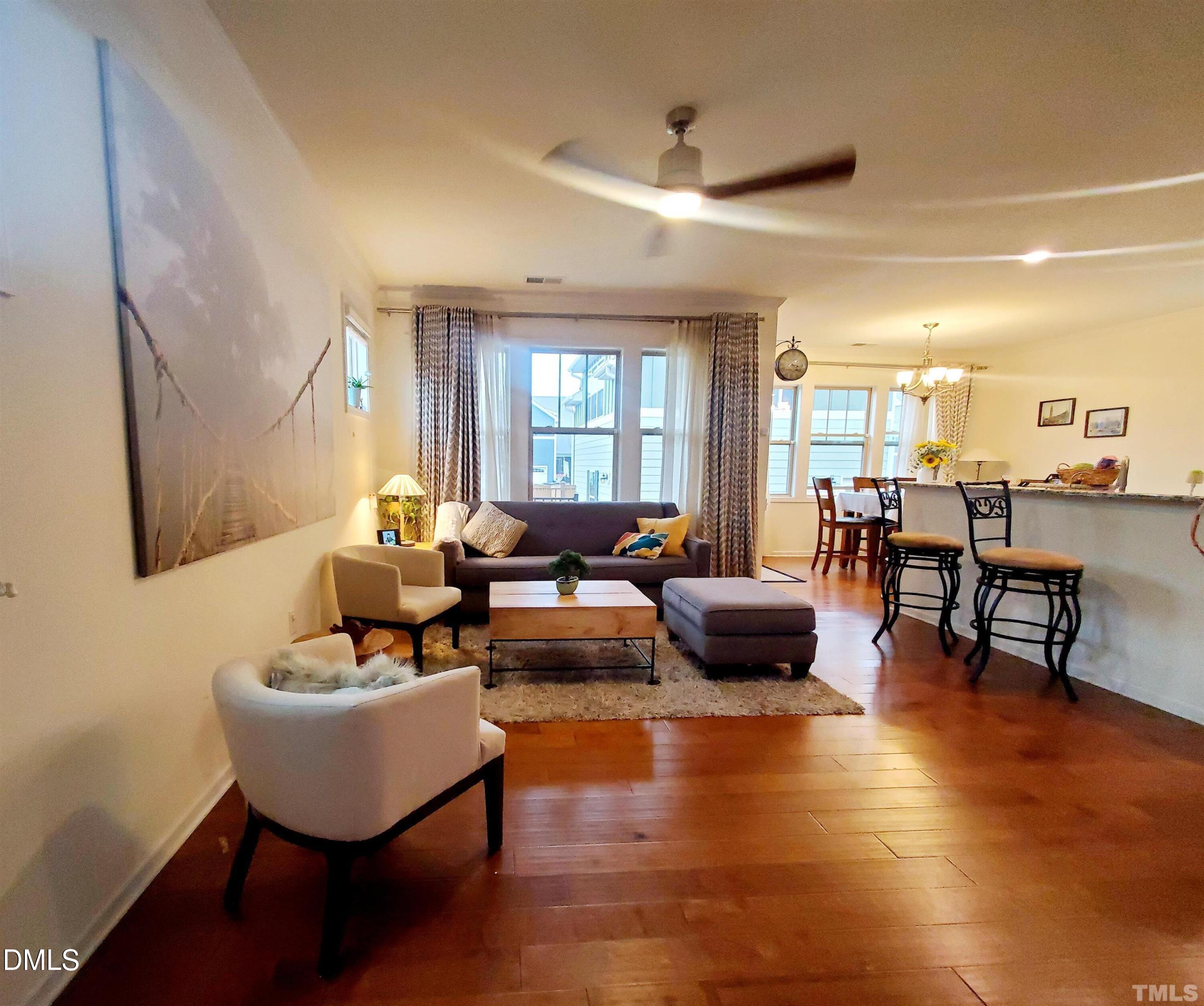 2700 Jockeys Rdg Trace Apex, NC 27502 - Photo 3 of 18 a living room with couches and kitchen view with wooden floor