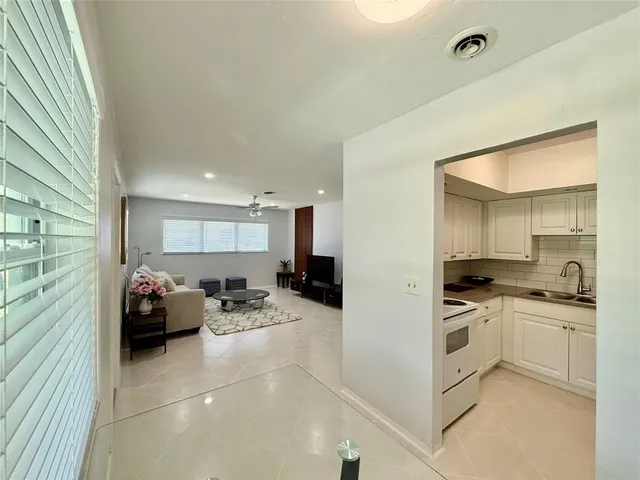 a kitchen with a sink cabinets and counter top space