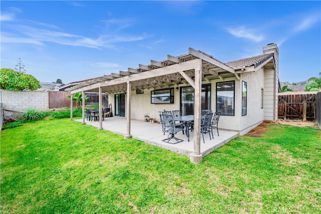 12052 Elk Boulevard Riverside, CA 92505 - Photo 16 of 25 a view of a house with patio and garden