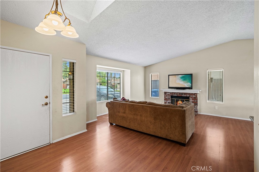 12052 Elk Boulevard Riverside, CA 92505 - Photo 3 of 25 a living room with furniture and a flat screen tv