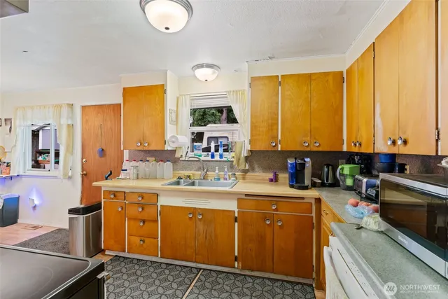 a bedroom with furniture and a window