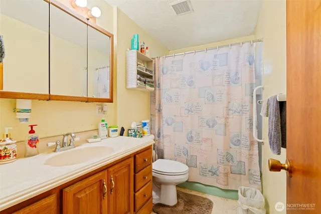 a bed room with a bed and a window