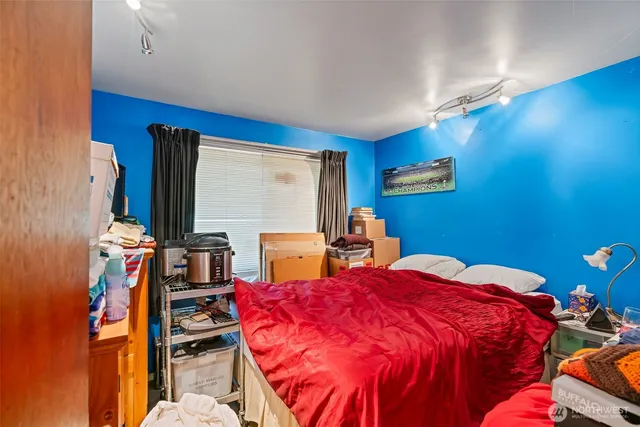 an aerial view of residential house with outdoor space and trees all around