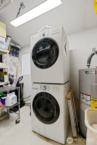 an aerial view of residential house with outdoor space and trees all around
