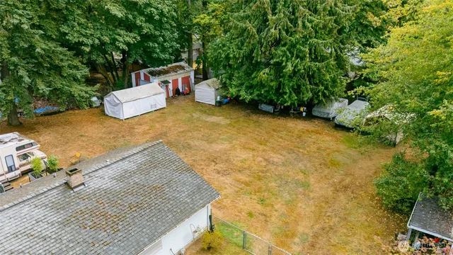 front view of a house with a tree