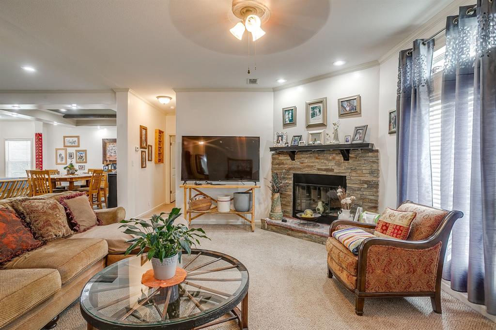 13740 County Road 4041 Scurry, TX 75158 - Photo 16 of 40 a living room with furniture and a fireplace