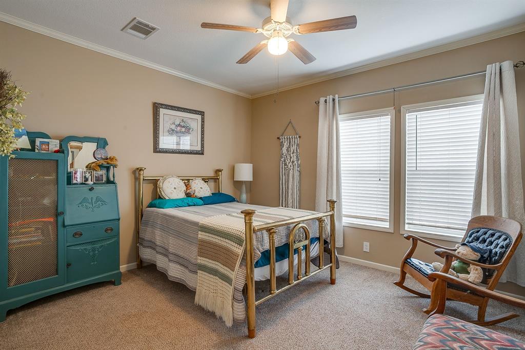 13740 County Road 4041 Scurry, TX 75158 - Photo 22 of 40 a bedroom with a bed and a window