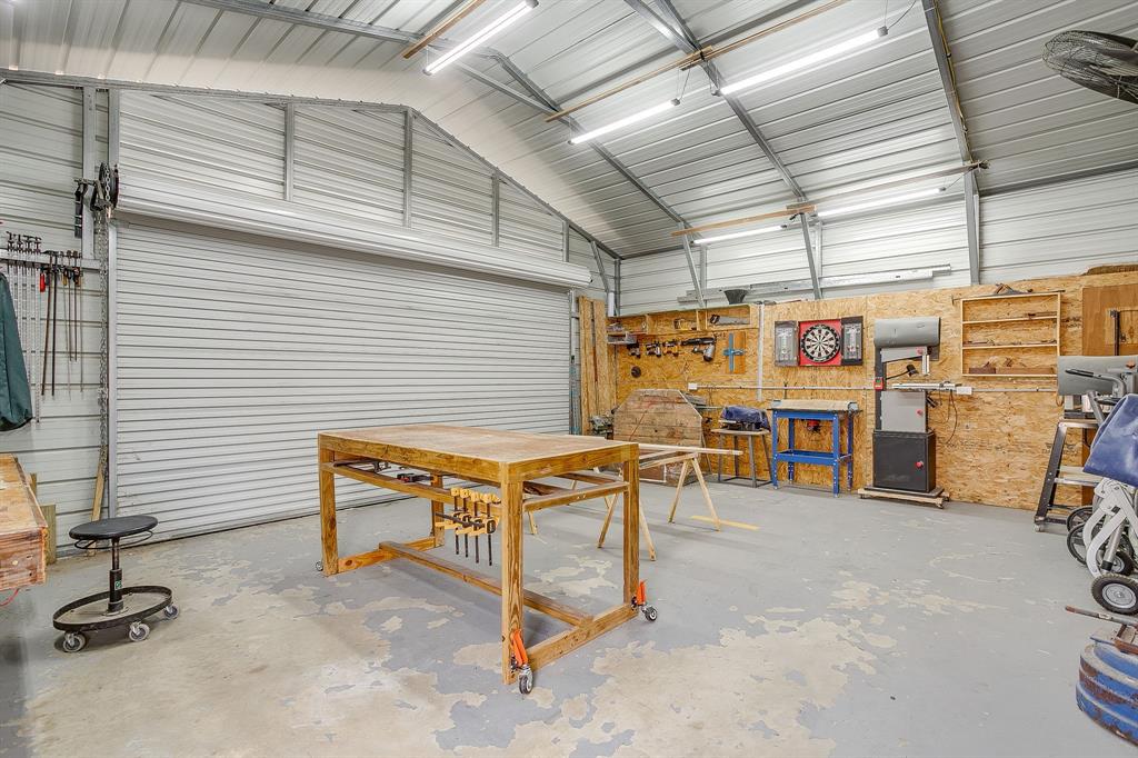 13740 County Road 4041 Scurry, TX 75158 - Photo 35 of 40 a view of a room with gym equipment