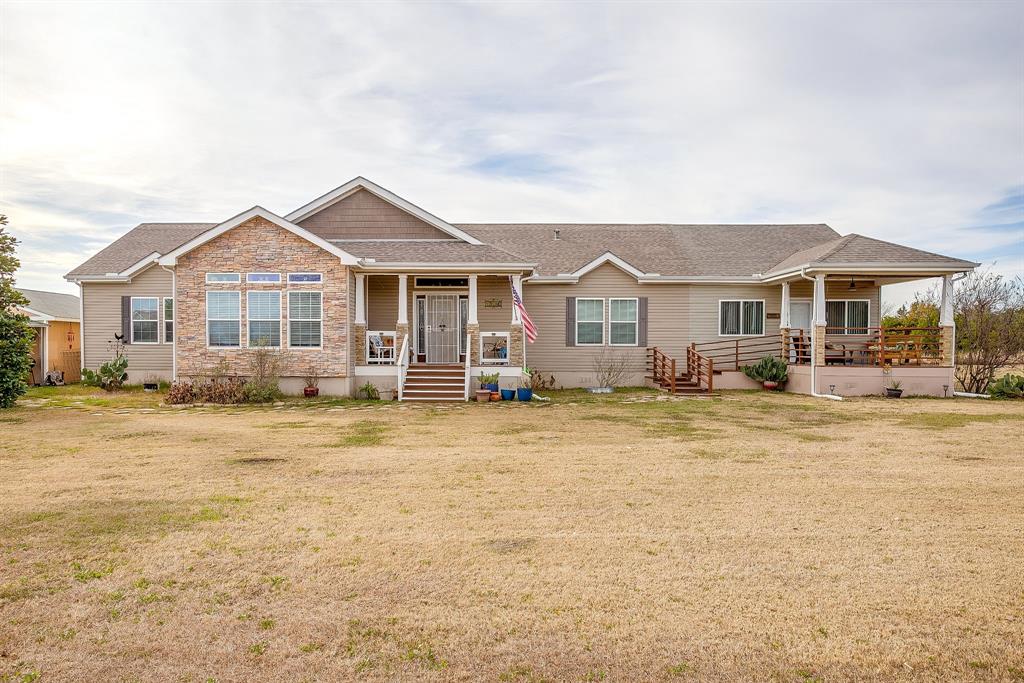 13740 County Road 4041 Scurry, TX 75158 - Photo 5 of 40 a front view of a house with a yard