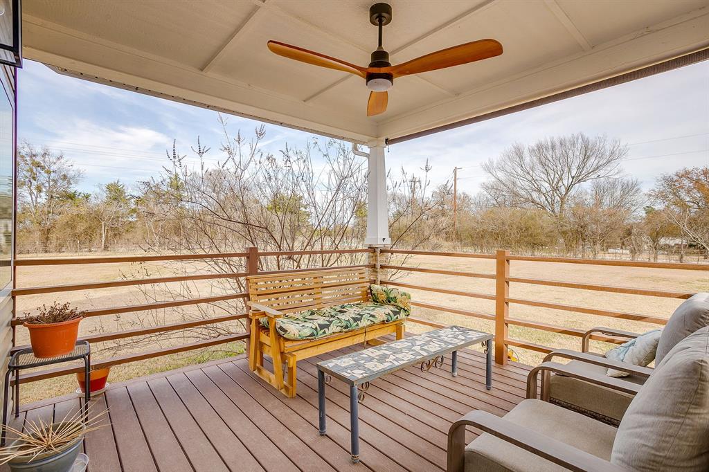13740 County Road 4041 Scurry, TX 75158 - Photo 8 of 40 a view of a balcony with furniture