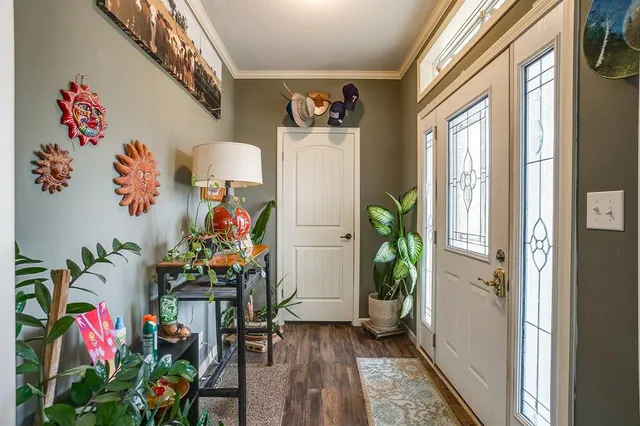 a view of an entryway with wooden floor